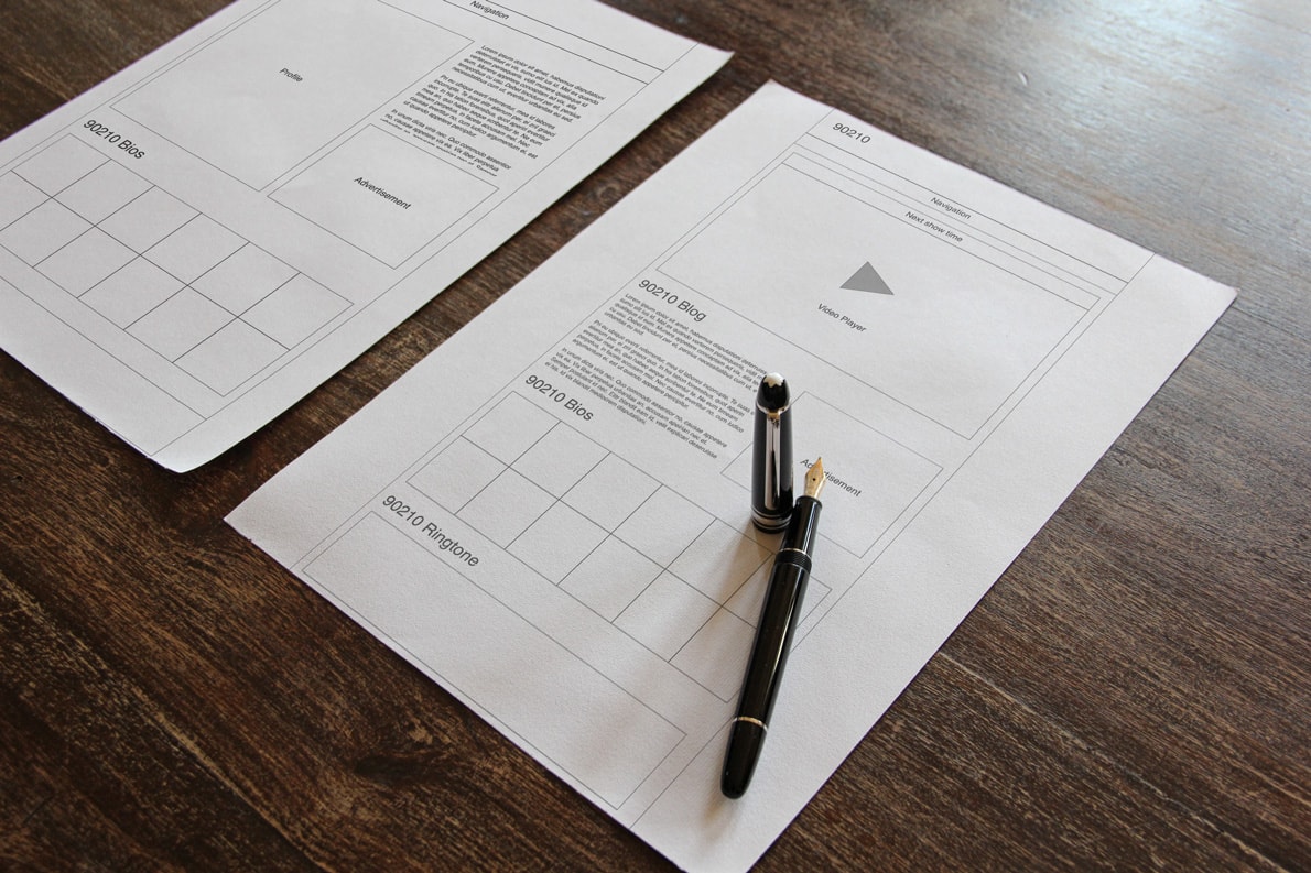 Graphic of a typography specimen showing the alphabet and numerals on top of a dark gray background.