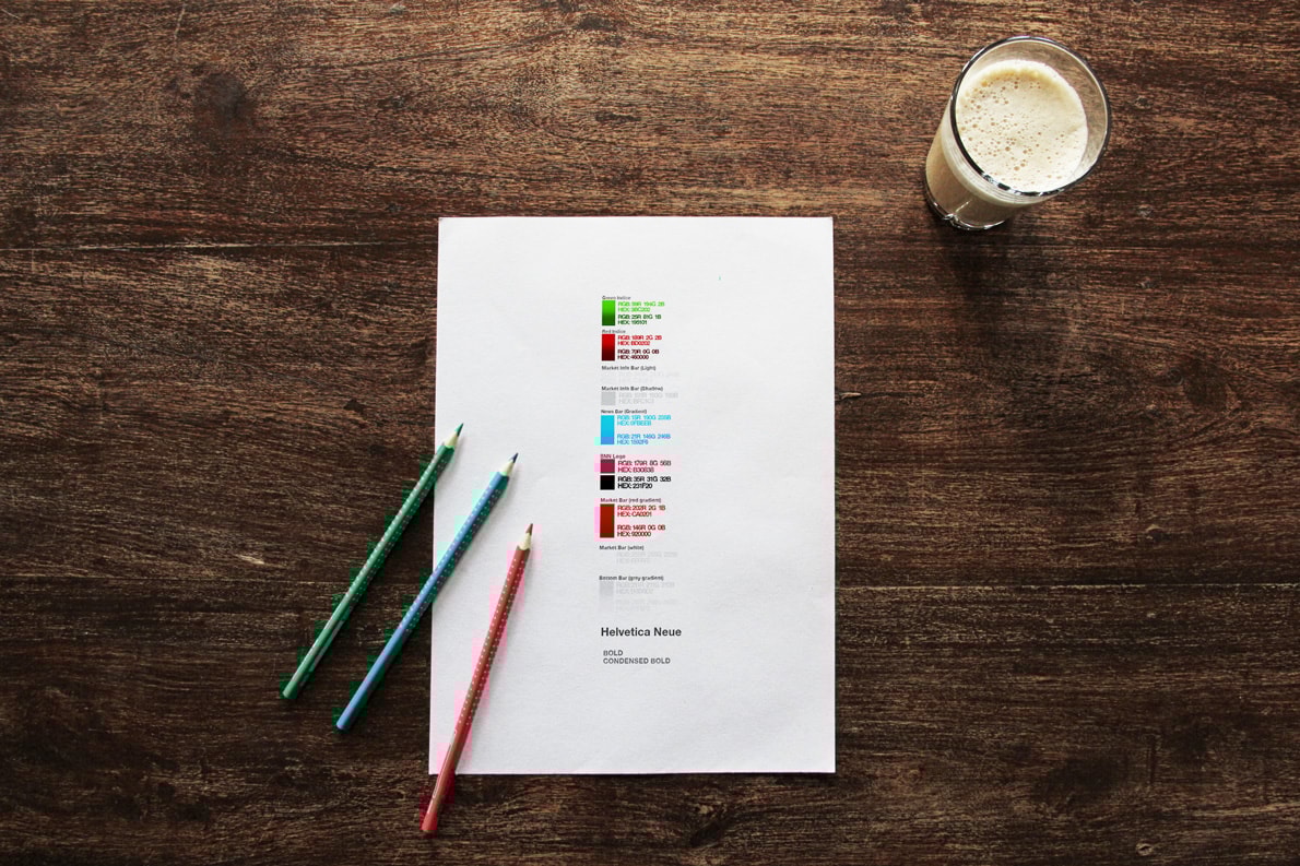 Graphic of a typography specimen showing the alphabet and numerals on top of a dark gray background.